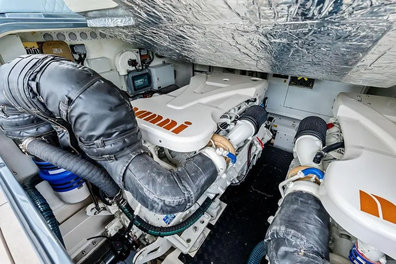 Slide: The Image of Engine room of 2024 Vanquish Yachts VQ55, showcasing advanced machinery and components. - 72