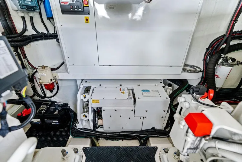 Slide: The Image of Engine room of 2024 Vanquish Yachts VQ55, showcasing advanced mechanical systems and components. - 74