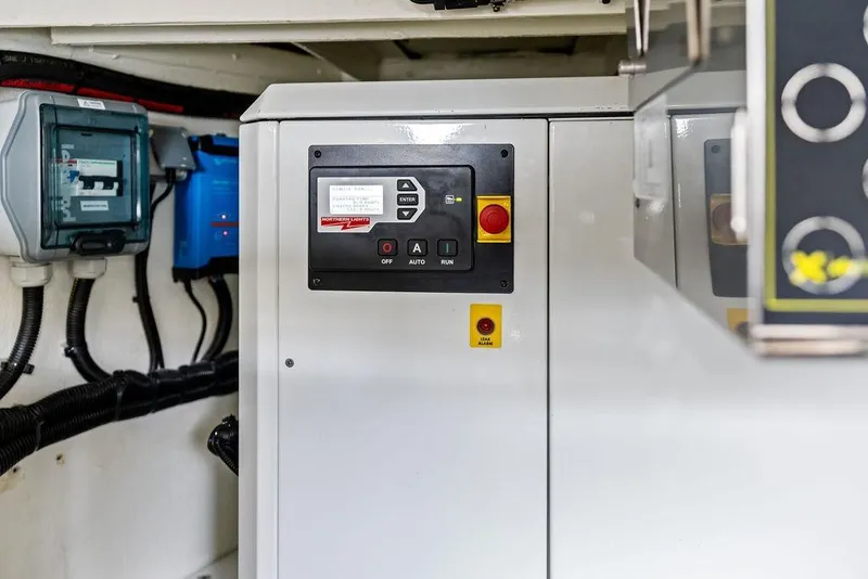 Slide: The Image of Control panel inside 2024 Vanquish Yachts VQ55, featuring various switches and indicators. - 76