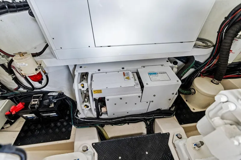 Slide: The Image of Engine room of 2024 Vanquish Yachts VQ55, showcasing mechanical components and wiring. - 77