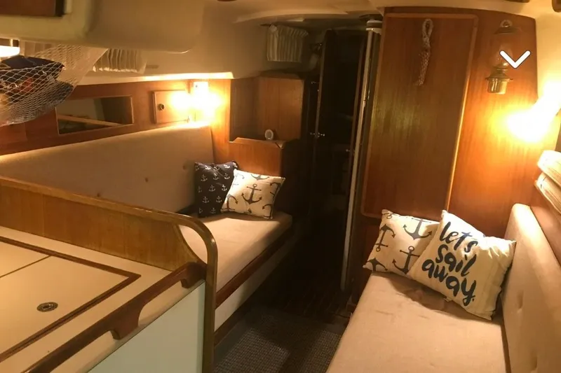 Slide: The Image of 1980 Pearson 365 Sloop sailboat on water, clear sky background. - 18