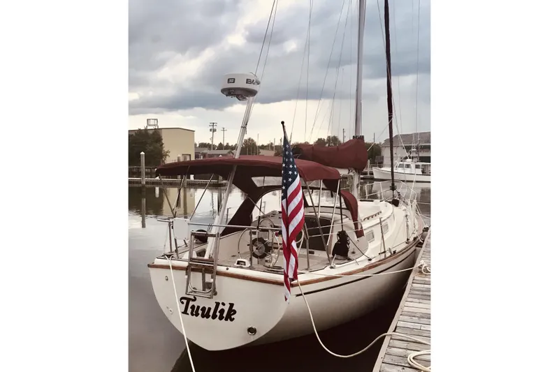 Slide: The Image of Interior of a 1980 Pearson 365 Sloop sailboat with wooden furnishings and seating. - 2