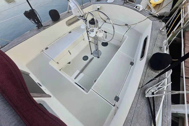 Slide: The Image of Cockpit of 1980 Pearson 365 Sloop sailboat with steering wheel and seating. - 29