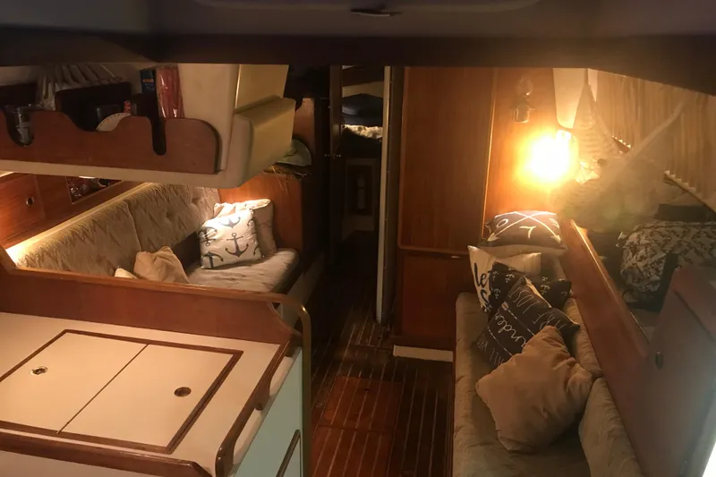 Slide: The Image of Cockpit of 1980 Pearson 365 Sloop with cushioned seating and steering wheel. - 3