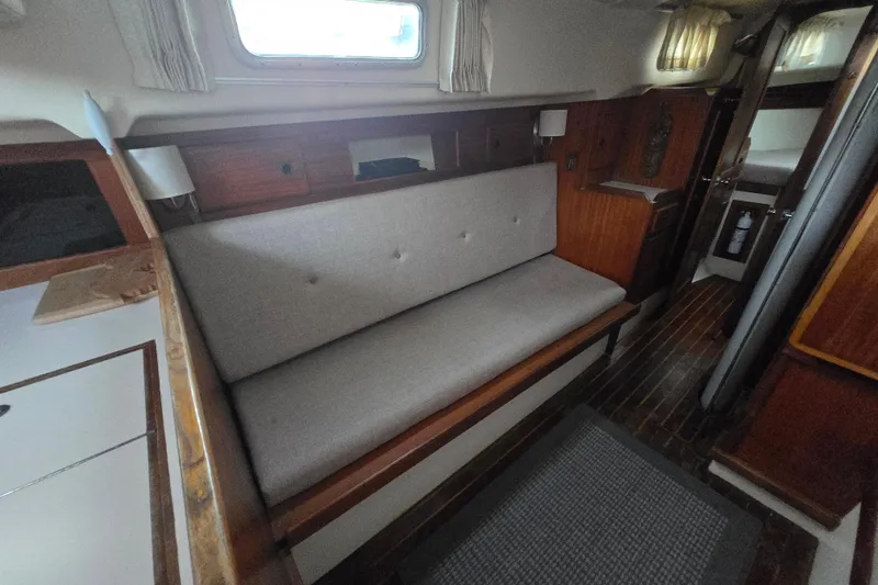 Slide: The Image of Interior of a 1980 Pearson 365 Sloop sailboat with a cozy seating area. - 51