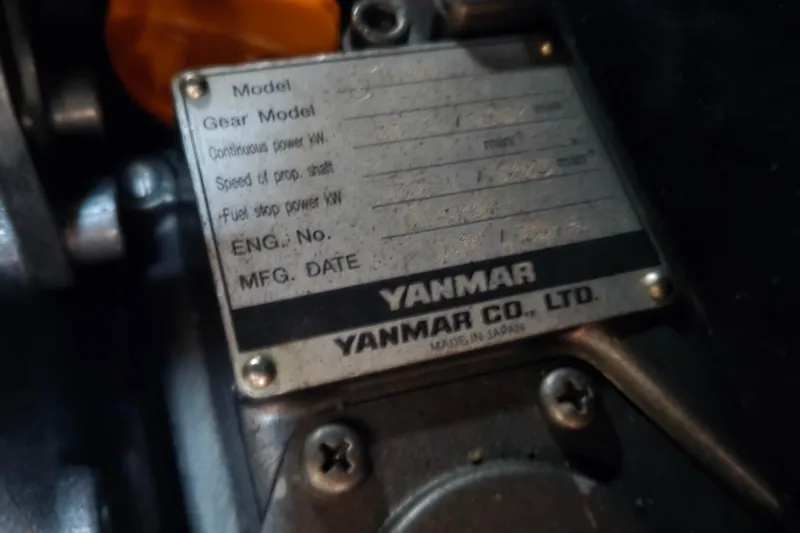 Slide: The Image of Yanmar engine plate on a 1980 Pearson 365 Sloop, showing specifications and manufacturing details. - 62