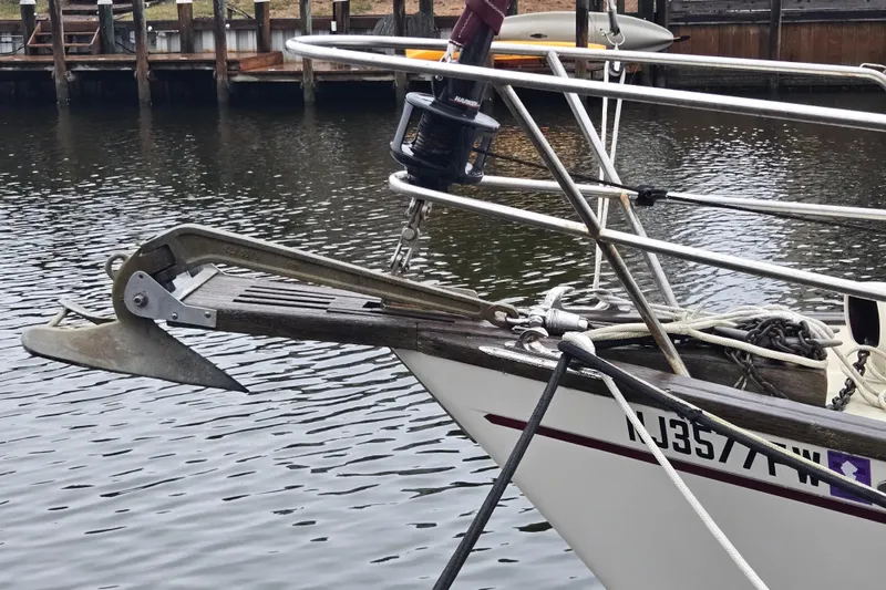 Slide: The Image of 1980 Pearson 365 Sloop sailboat docked, featuring maroon canopy and clean deck. - 11