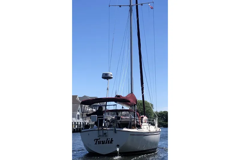 Slide: The Image of 1980 Pearson 365 Sloop sailboat docked, showcasing sleek design and classic craftsmanship. - 15