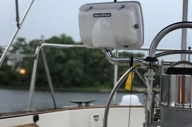 Slide: The Image of Sailing on a 1980 Pearson 365 Sloop with red and white sails against a cloudy sky. - 16