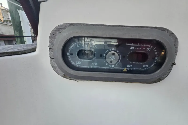 Slide: The Image of Instrument panel on a 1980 Pearson 365 Sloop sailboat, displaying wind and speed gauges. - 32