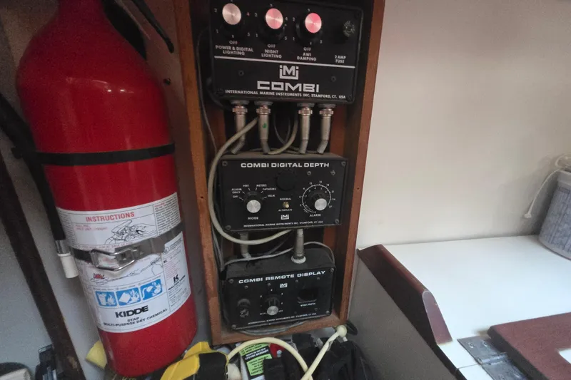 Slide: The Image of Control panel and fire extinguisher inside a 1980 Pearson 365 Sloop sailboat. - 41