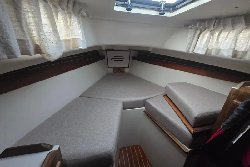 Slide: The Image of Interior cabin of a 1980 Pearson 365 Sloop sailboat with cushioned seating. - 44