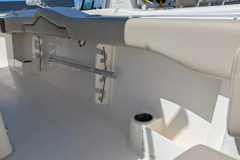 Slide: The Image of Interior view of 2023 Key West 263 FS boat, featuring rod holders and cup holder. - 11