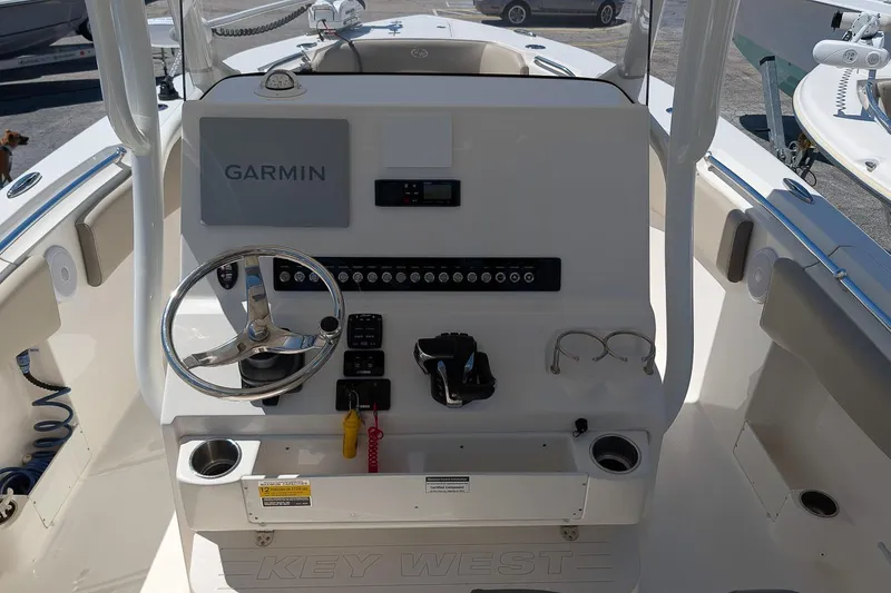 Slide: The Image of 2023 Key West 263 FS boat dashboard with Garmin navigation system and steering wheel. - 16