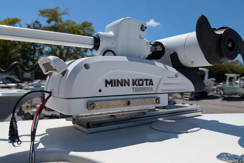 Slide: The Image of Minn Kota Terrova motor on 2023 Key West 263 FS boat, sunny day background. - 23