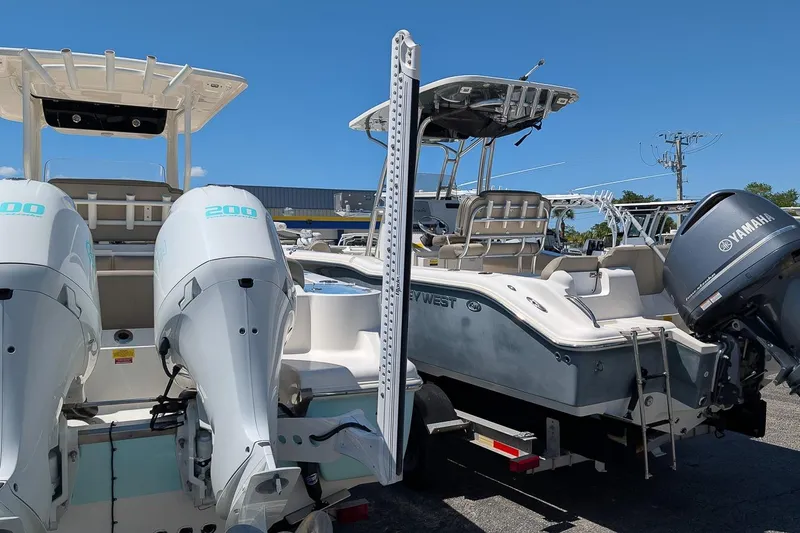 Slide: The Image of 2023 Key West 263 FS boats with Yamaha outboard engines in a marina setting. - 6