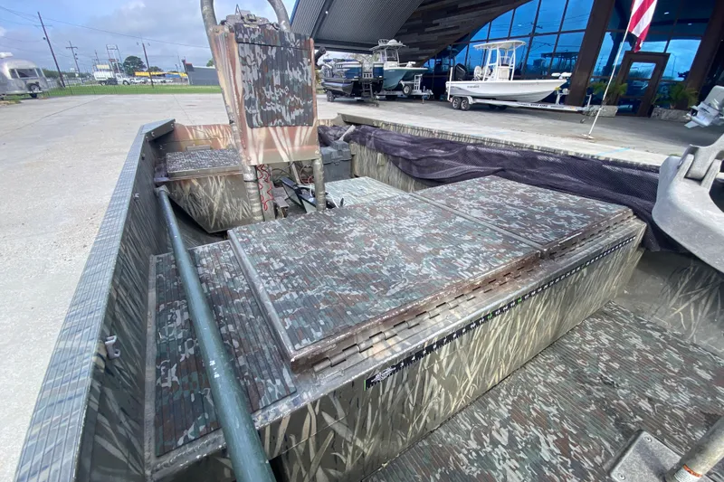 Slide: The Image of 2009 Gator Trax MUD BUDDY 17 X 50 boat with camouflage interior design. - 12