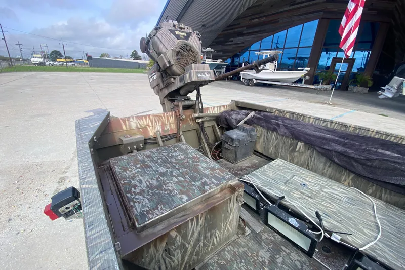 Slide: The Image of 2009 Gator Trax MUD BUDDY 17 X 50 boat with camouflage interior and motor. - 13