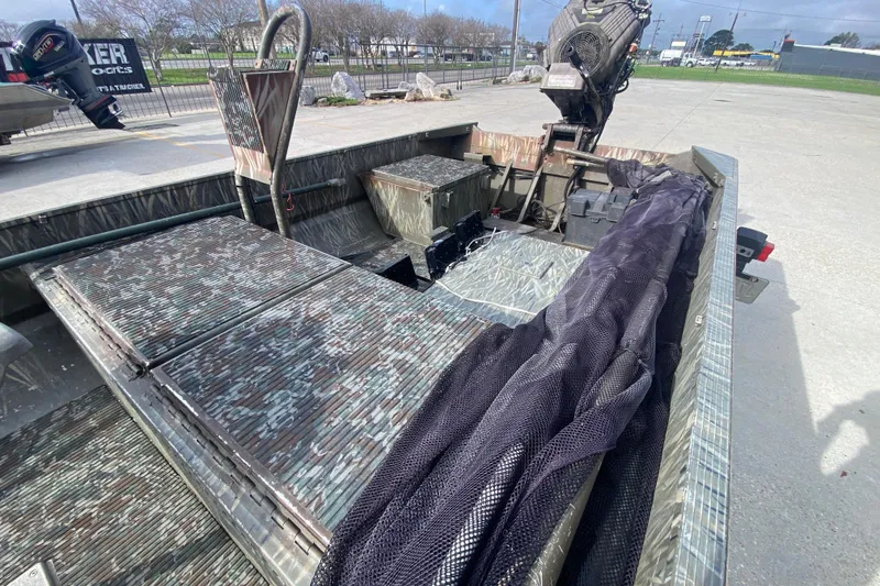 Slide: The Image of 2009 Gator Trax MUD BUDDY 17 X 50 boat with camouflage interior and motor. - 19