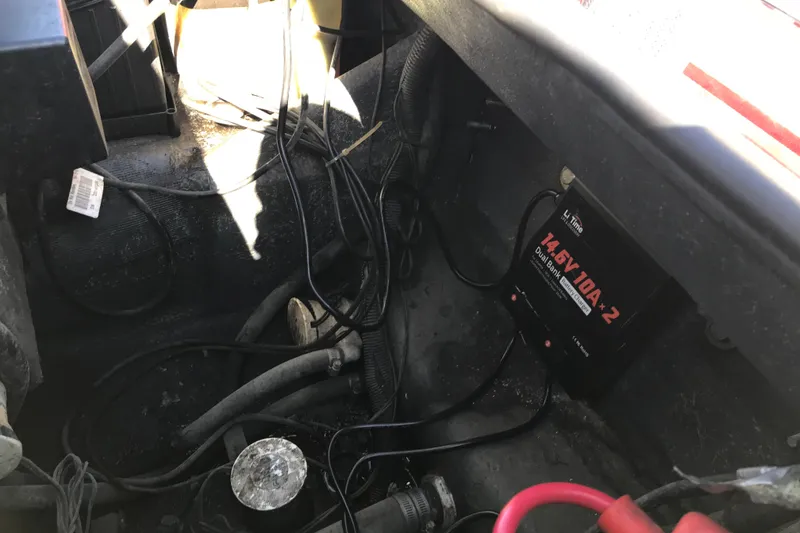 Slide: The Image of 2008 Triton 18 Explorer boat wiring with battery charger and cables. - 18