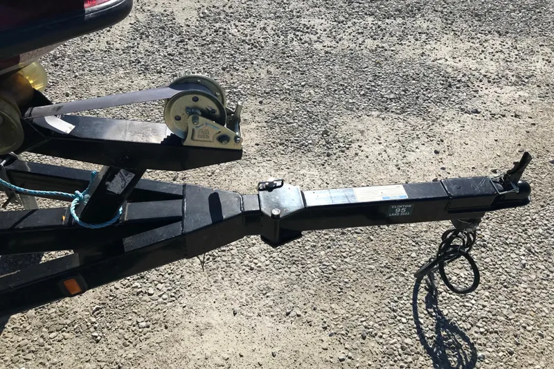 Slide: The Image of Trailer hitch of a 2008 Triton 18 Explorer on gravel surface. - 9