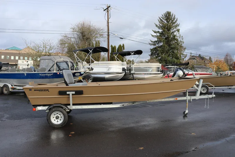 The Image of 2025 Smoker Craft 1648 Jon boat on trailer, parked outdoors. - 1