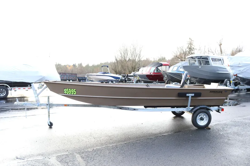Slide: The Image of 2025 Smoker Craft 1648 Jon boat on trailer, priced at $5995, in outdoor setting. - 4