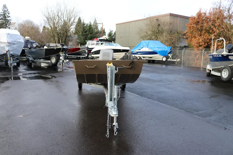 Slide: The Image of 2025 Smoker Craft 1648 Jon boat on trailer in outdoor lot. - 5