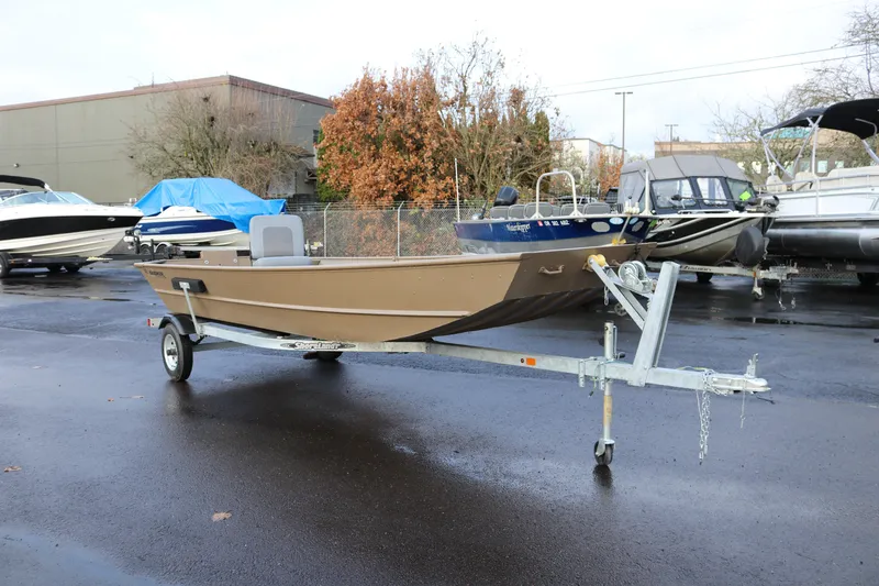Slide: The Image of 2025 Smoker Craft 1648 Jon boat on trailer in parking lot. - 6