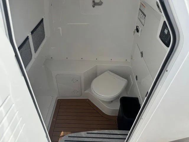 Slide: The Image of Interior of Everglades 285 Center Console 2026 with toilet. - 33