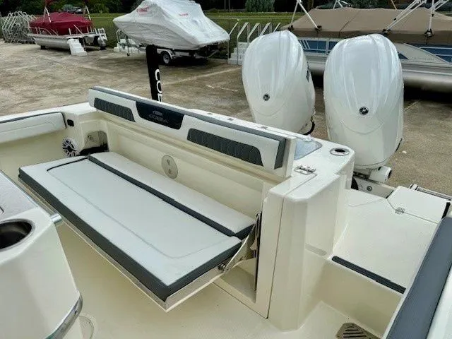 Slide: The Image of 2025 Cobia 265 Center Console with dual engines and seating. - 24