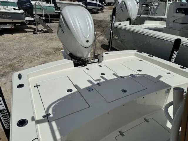 Slide: The Image of Pathfinder 2600 HPS 2025 boat with outboard motor at a dock. - 19