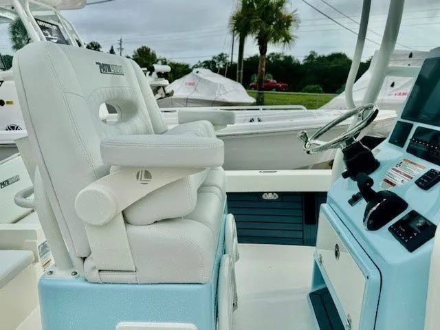 Slide: The Image of Interior of 2025 Pathfinder 2600 TRS with helm console and seating. - 29