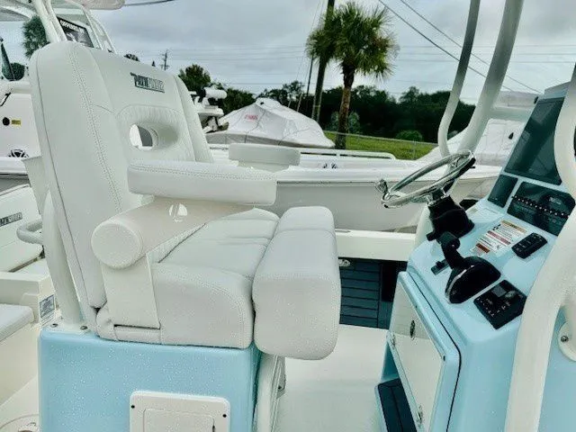 Slide: The Image of Interior of 2025 Pathfinder 2600 TRS boat with white seat and helm console. - 30