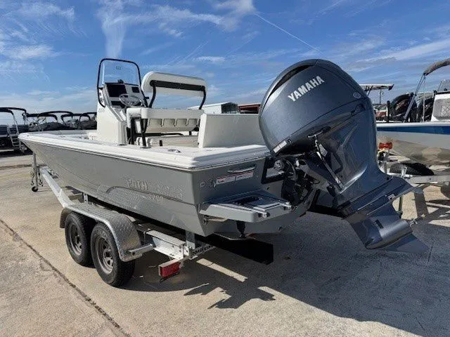 Slide: The Image of Pathfinder 2200 TRS 2025 boat with Yamaha engine on trailer. - 21