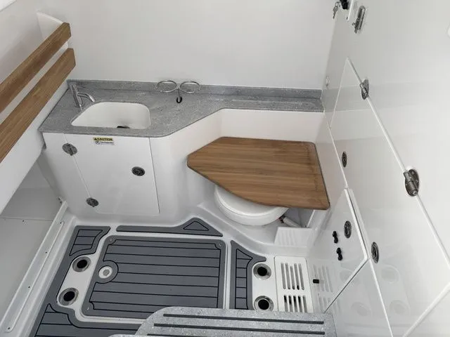 Slide: The Image of Interior of Everglades 315 Center Console 2026 with sink and toilet. - 40