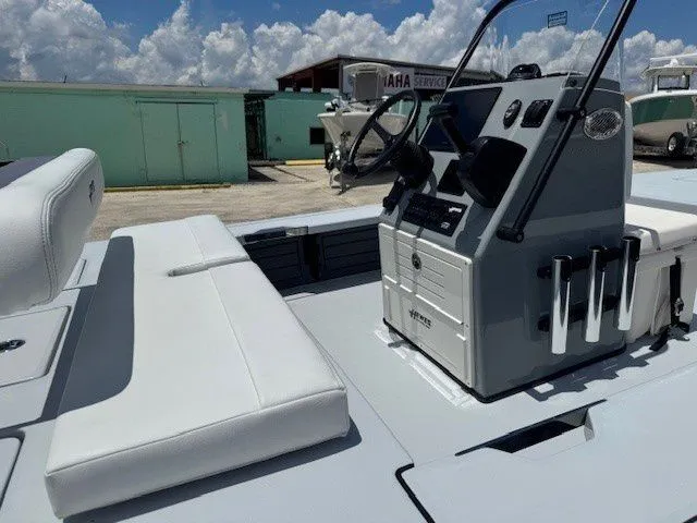 Slide: The Image of 2026 Hewes Redfisher 18 boat with console and seating area. - 24