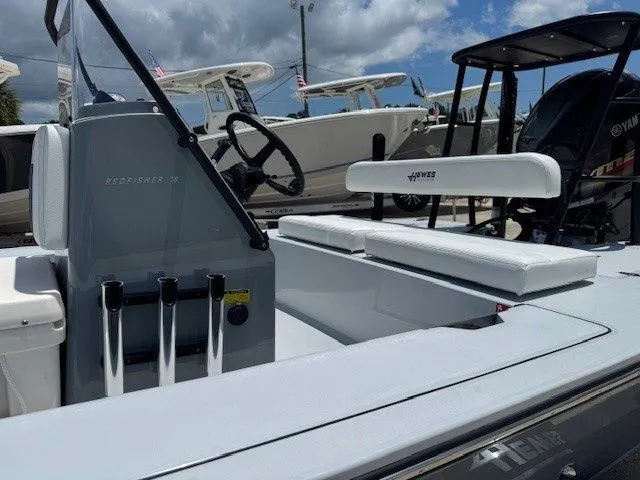 Slide: The Image of 2026 Hewes Redfisher 18 boat with console and seating area. - 25