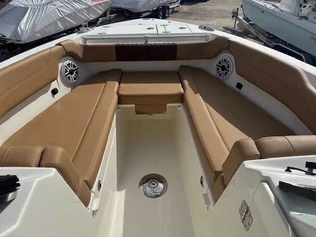 Slide: The Image of Interior of 2026 Cobia 280 Dual Console with brown seating. - 23