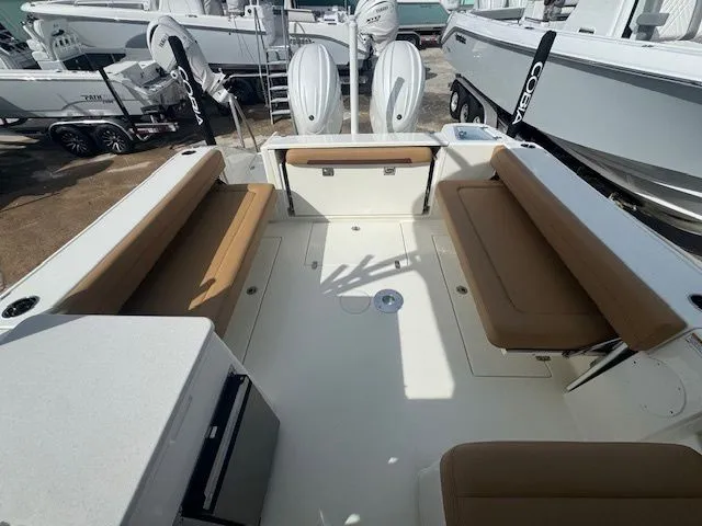 Slide: The Image of 2026 Cobia 280 Dual Console with spacious cockpit and comfortable seating. - 28