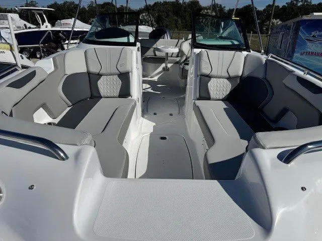 Slide: The Image of Interior view of 2026 Hurricane SunDeck 2400 OB with gray seating. - 23