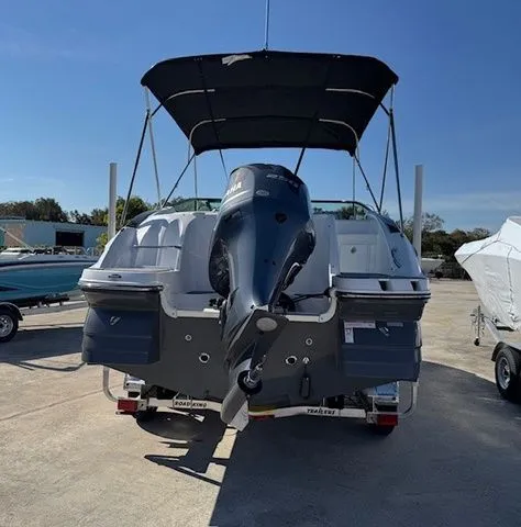 Slide: The Image of 2026 Hurricane SunDeck 2400 OB with outboard motor on trailer. - 24