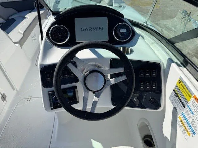 Slide: The Image of 2026 Hurricane SunDeck 2400 OB helm with Garmin navigation system. - 29