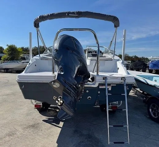 Slide: The Image of 2026 Hurricane SunDeck 2050 OB boat with outboard motor and ladder. - 24