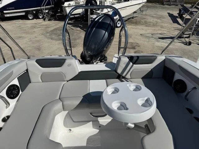 Slide: The Image of Interior of 2026 Hurricane SunDeck 2050 OB with table and seating area. - 26