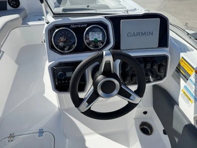 Slide: The Image of Hurricane SunDeck 2050 OB 2026 helm with Garmin display. - 29