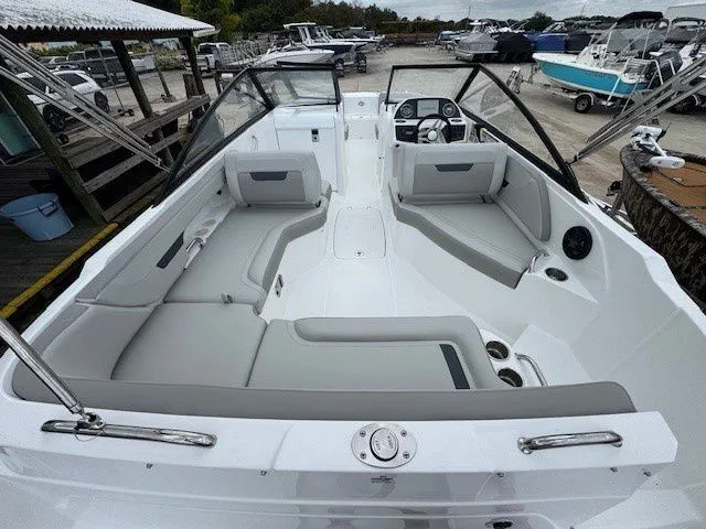 Slide: The Image of Interior view of 2026 Hurricane SunDeck 235 OB boat at dock. - 21