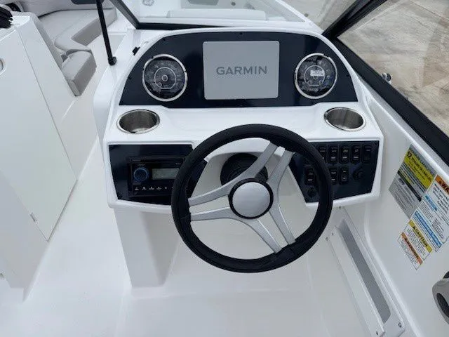 Slide: The Image of 2026 Hurricane SunDeck 235 OB helm with Garmin navigation system. - 24