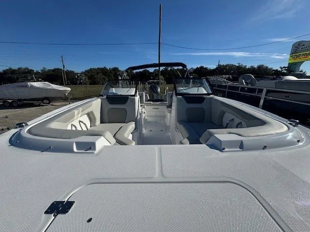 Slide: The Image of 2026 Hurricane SunDeck 2050 OB boat with spacious deck and seating area. - 19
