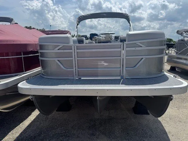 Slide: The Image of 2026 Bennington 22SSRSE pontoon boat under cloudy sky. - 24